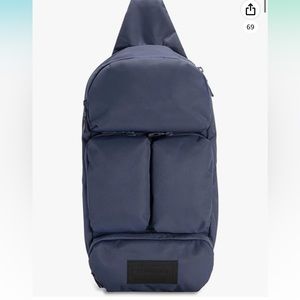 TIMBUKTU Vapor Sling Crossbody in Cocoa/dark green.